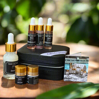 Collection of Oahu Organics skincare products on a wooden surface with a product image card.