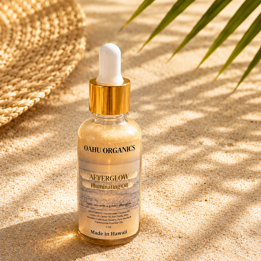 bottle of shimmering oil on a sandy beach