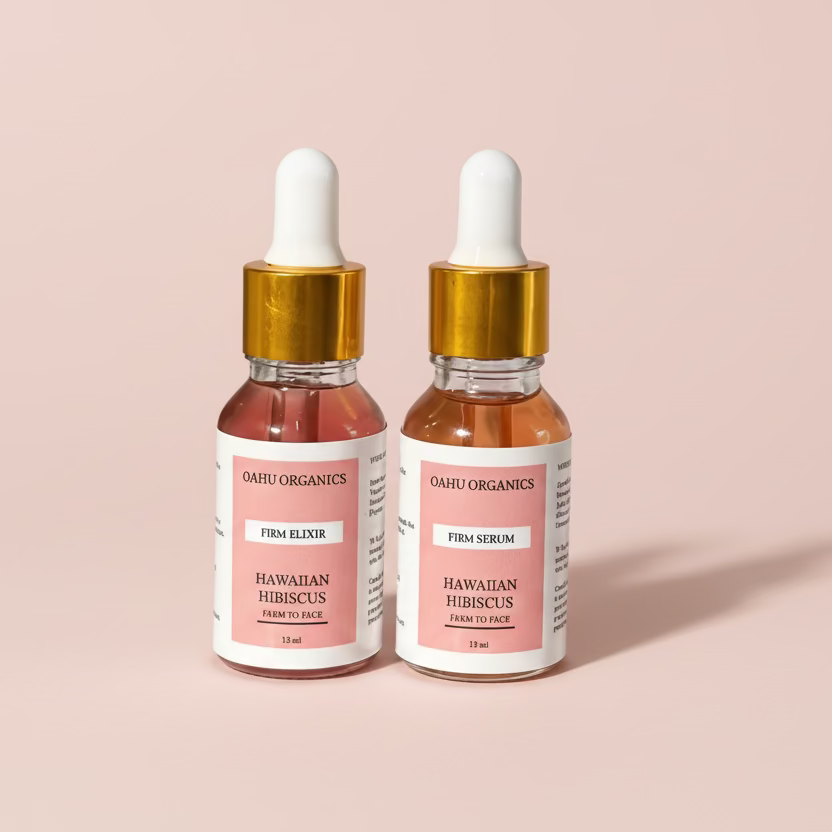 Two Oahu Organics skincare bottles with gold caps on a white background