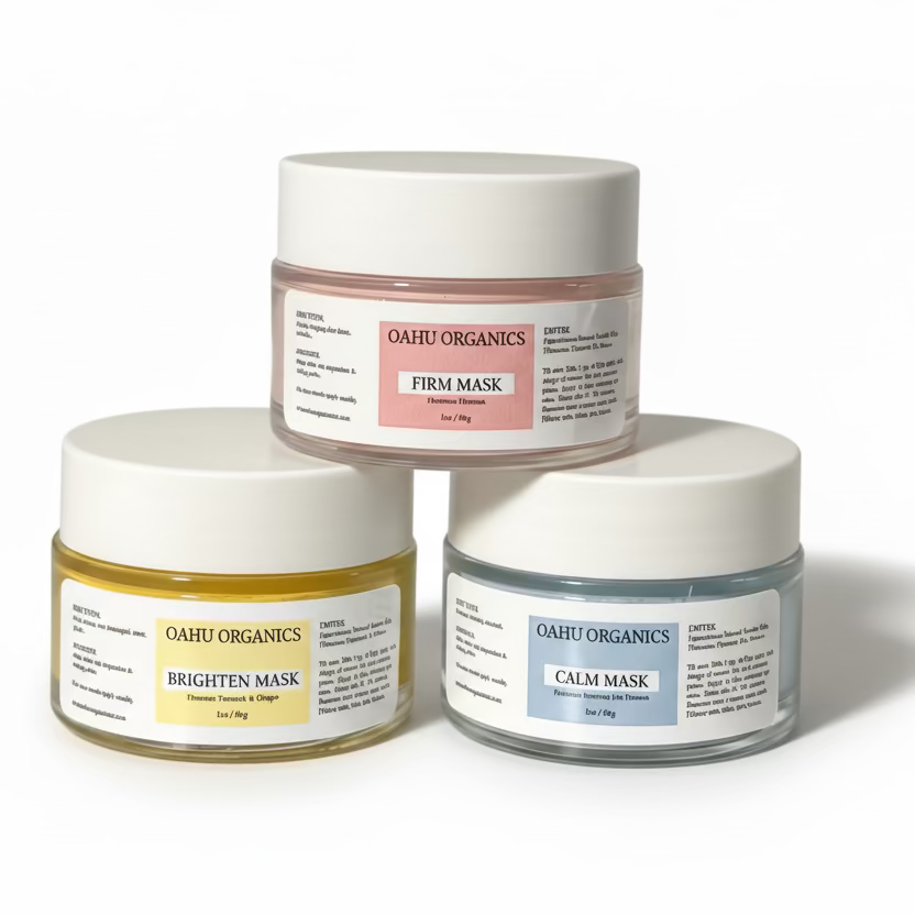Three jars of Oahu Organics masks on a light background