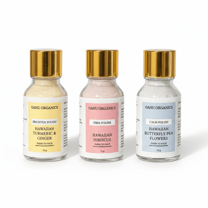 botanical Exfoliating Face Polish - OahuOrganics - yellow, pink and blue bottles on white background.